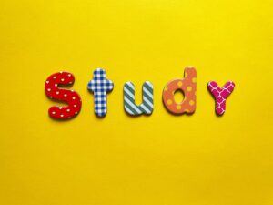 a yellow background with the word study spelled out
